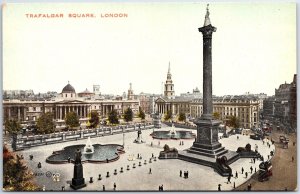 VINTAGE POSTCARD CROWDS AND STREET SCENE AT TRAFALGAR SQUARE LONDON UK c. 1910