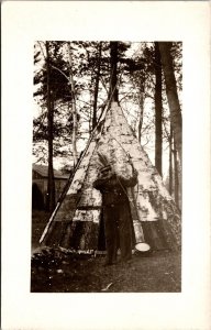 Real Photo Postcard Indian Man Shooting Bow and Arrow In Front of Tipi Tepee