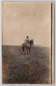 Man and Horse in Field RPPC Ashton IL Nelson Schmidt Lauren IA Postcard Z28