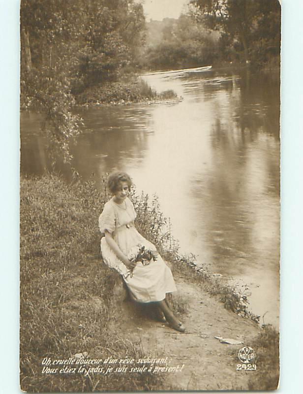 Circa 1910 rppc PRETTY GIRL HOLDING FLOWER BOUQUET BY THE RIVER r6676