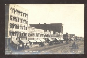 RPPC ENID OKLAHOMA DOWNTOWN DIRT STREET SCENE STORES REAL PHOTO POSTCARD