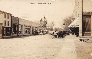 J68/ Brandon Wisconsin RPPC Postcard c1910 Main St Ferguson Stores 435