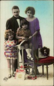 1920s Family Girls Mother Father Books/Toys Tinted Real Photo Postcard myn