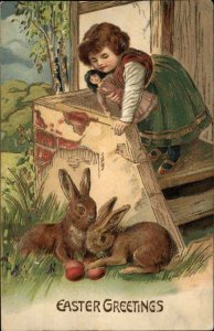 Easter Little Girl with Doll Dolly Bunny Rabbits Easter Eggs c1910 Postcard