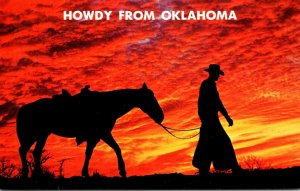 Oklahoma Howdy With Cowboy and Horse At Sunset