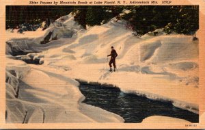 New York Adirondacks Lake Placid Skier Pausing By Mountain Brook 1951 Curteich