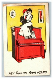 Vintage 1907 Comic Postcard - Woman & Man Embrace Sitting on Upright Piano