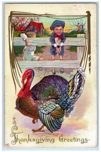 c1910's Thanksgiving Greetings Boy Climbing Fence Turkey Embossed Postcard 