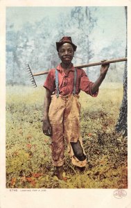 LOOKING FOR A JOB CHILD WITH HOE / RAKE BLACK AMERICANA POSTCARD (1902)