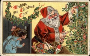 Christmas Santa Claus Decorating Tree with Toys c1910 Vintage Postcard