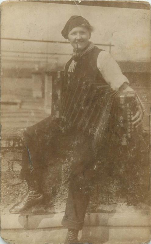 Old snapshot photo postcard pipe smocker girl with harmonica music instrument