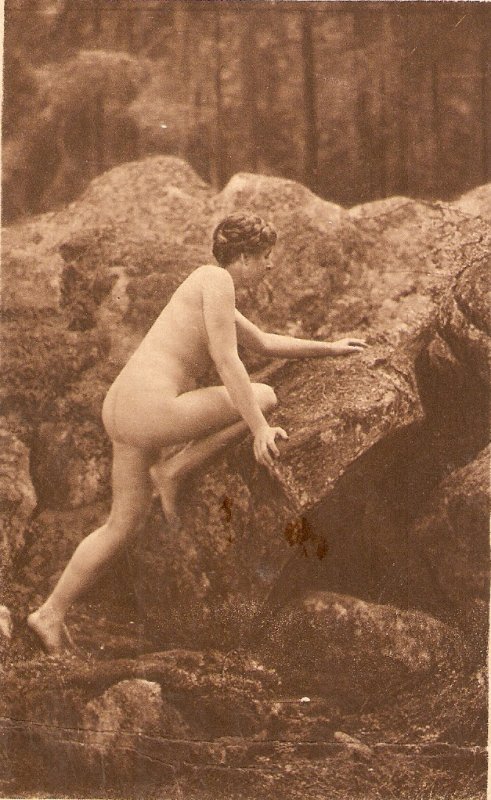 Nude lady climbing a rock Old vintage antique postcard