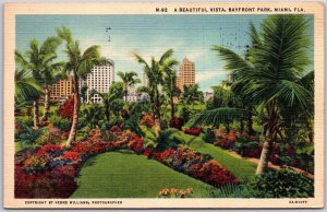 1937 Miami FL-Florida, A Beautiful Vista, Bayfront Park, Flowers & Palm Postcard