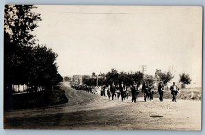 c1910's Marching Band Main Street Small Town RPPC Photo Antique Postcard
