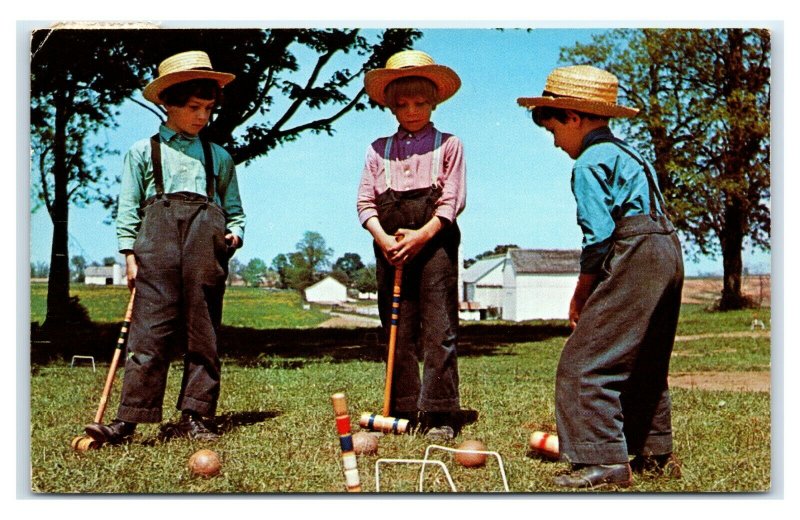 Postcard Greetings from The Amish Country - children playing croquet 1963 E21