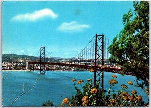 VINTAGE CONTINENTAL SIZE POSTCARD THE SALAZAR BRIDGE RIVER TAGUS LISBON PORTUGAL