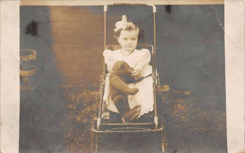 Real Photo Postcard~Little Girl in Baby Stroller Holds Steiff Teddy Bear~c1912  