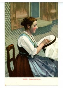 Switzerland - Appenzellerland. Young Woman Sewing in the Alps