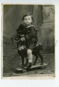 427916 RUSSIA Little boy toys HORSE with TEDDY BEAR his hands 1950 KAZAN photo