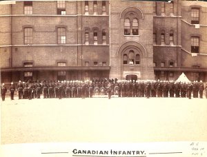 Canadian Infantry In Front Of Large Building Photograph