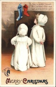 Clapsaddle Little Girls Compare Christmas Stockings c1910 Int'l Art Postcard