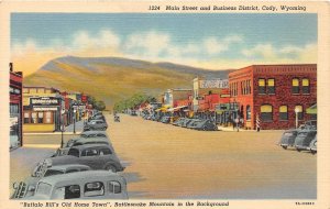 G58/ Cody Wyoming Postcard Linen Main Street Stores Automobiles