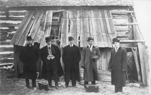 Postcard RPPC C-1910 Five well dressed gentlemen log barn TP24-1937