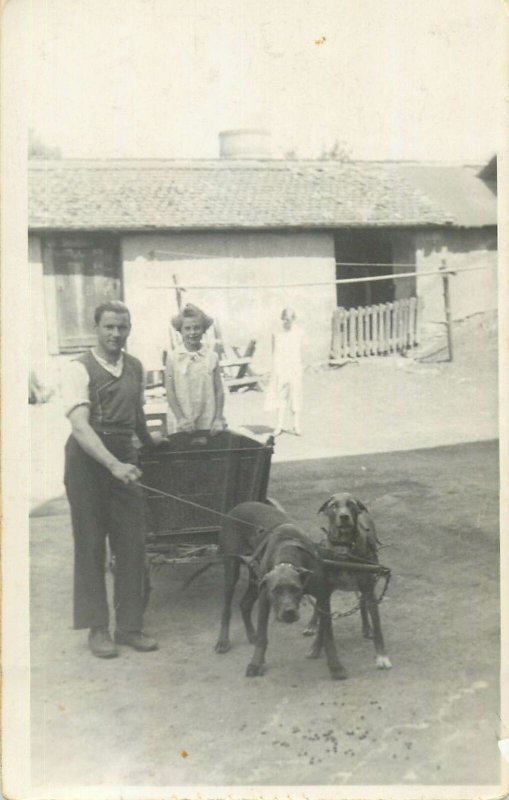 Social history Postcard man with young daughter cart dog breed