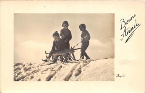 Children sledding in snow  RPC