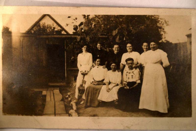 pre-1920's rppc WOMAN WITH UMBRELLA IN NINE WOMAN GROUP PHOTO card y5324