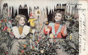 YOUNG GIRLS HOLDING JESTERS-HORN-DOLL-DECORATED CHRISTMAS TREE~1905 POSTCARD