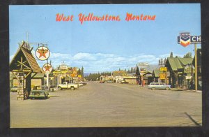 WEST YELLOWSTONE MONTANA DOWNTOWN STREET SCENE OLD CARS VINTAGE POSTCARD