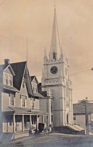 MACHIAS MAINE~CHURCH-STEEPLE-CLOCK-BUGGY IN FRONT OF STORE-REAL PHOTO POSTCARD