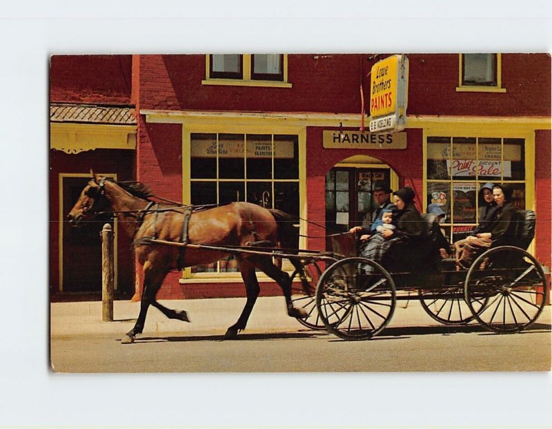 Postcard Mennonite family, a common Main street scene, St. Jacobs, Canada