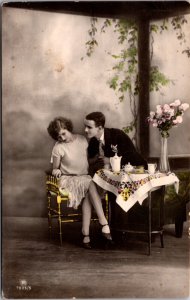 Hand Colored Real Photo Studio Postcard Man Leaning In To Kiss Woman Tea Time