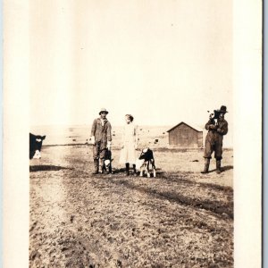 c1910s Awesome Farm RPPC Man Holds Baby Calf Cow Cattle Overalls Photo Girl A211