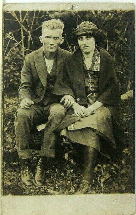 1910s 20s RPPC Rural Farm Man And Woman Seated On Log Postcard Americana