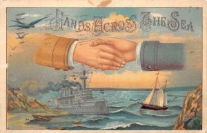 HANDS ACROSS THE SEA MILITARY SHIP EMBOSSED POSTCARD 1913