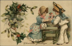 Christmas - Fancy Boy & Girl Exchange Flowers c1910 Embossed Postcard