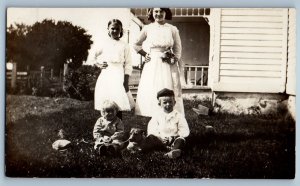 c1910's Mother And Children With Dog House Backyard RPPC Photo Antique Postcard