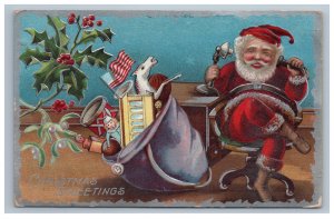 Chistamas Santa on Candlestick Telephone at Desk Postcard Embossed Toys Flag