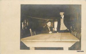 1910 Serious well dressed men at Table RPPC Real photo 1416 