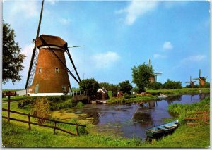 CONTINENTAL SIZE POSTCARD WINDMILLS AT KINDERDIJK HOLLAND NETHERLANDS