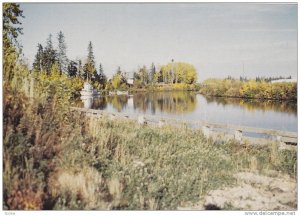 The peaceful beauty of fall colours adorn the Hay River, Canadian North,  Can...