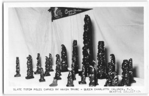 Postcard Indian Totem Poles Haida Tribe Queen Charlotte Islands, BC Pennant RPPC