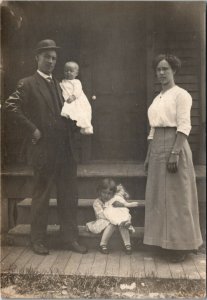 Postcard RPPC Real Photo Man Holding Baby, Girl with Doll & Wife C.1910 K3