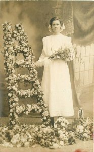 C-1910 Young Woman Floral Trellis Photo Studios RPPC Photo Postcard 21-11745