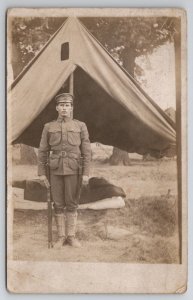 Marshall IL Attractive US Soldier Posing with Weapons Tent Scene Postcard J21