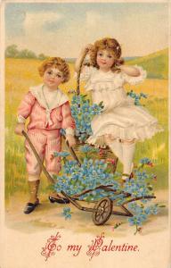 To My Valentine boy and girl with flowers in cart antique pc Y14388