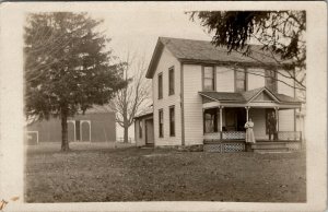 RPPC Farmhouse Man Woman holding Cat or Dog c1910 Postcard V8